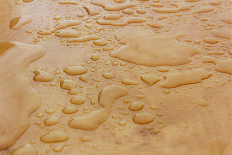 sheet of marine plywood with water on the surface