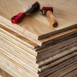 Stack of Marine Plywood panels with a tools on top