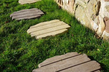 stepping stones in use in a grassed area